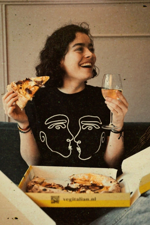 girl eating vegan pizza